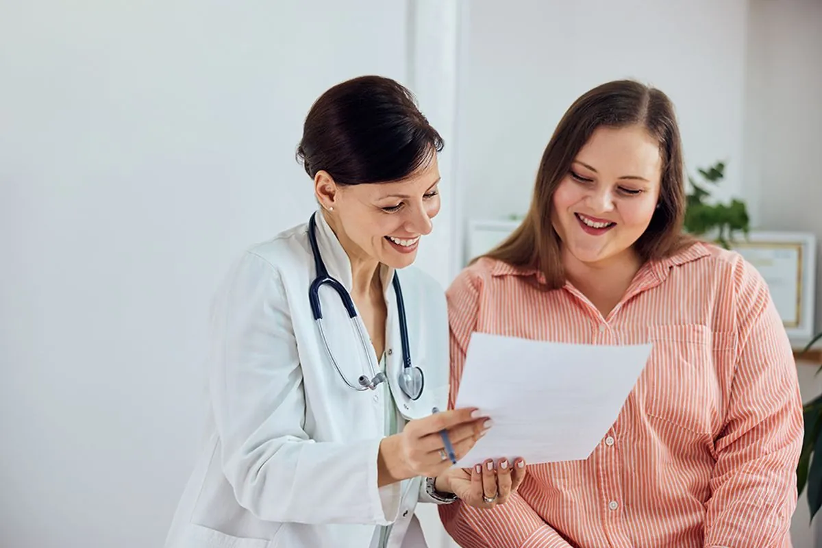 A physician and patient reviewing results together
